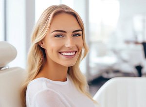 Smiling patient in dental treatment chair