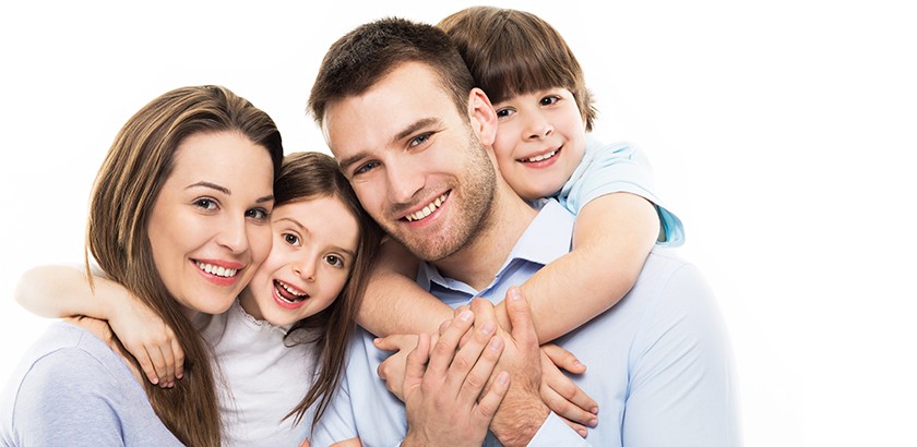 Family of four smiling