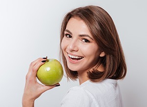 smiling woman with apple