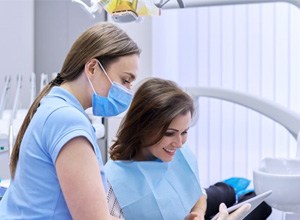 Patient and dental team member reviewing payment options