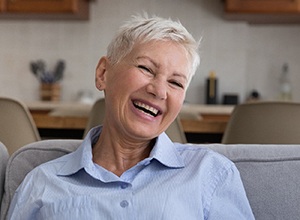 Happy older woman, glad she could afford her dentures