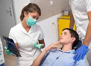 Patient and dentist discussing treatment options
