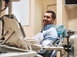 Smiling dental patient in treatment chair