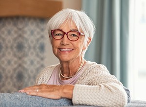 Smiling senior woman in her living room