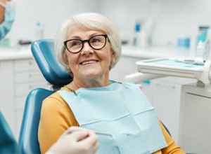 Senior patient talking with dental team member