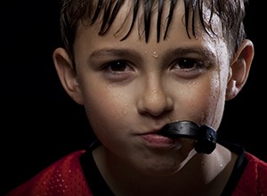 Young boy with athletic mouthguard
