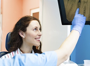 Woman looking at dental x-rays