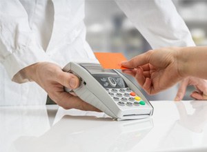 Patient using card to pay for services