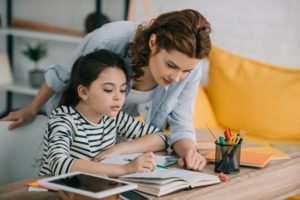 Mother and daughter sticking to a homeschooling schedule