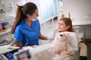 Happy little girl preparing to undergo sedation dentistry in Abington