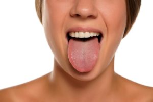 Woman’s healthy tongue after visit to dentist in Abington