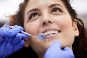 Close-up of smiling patient during dental exam